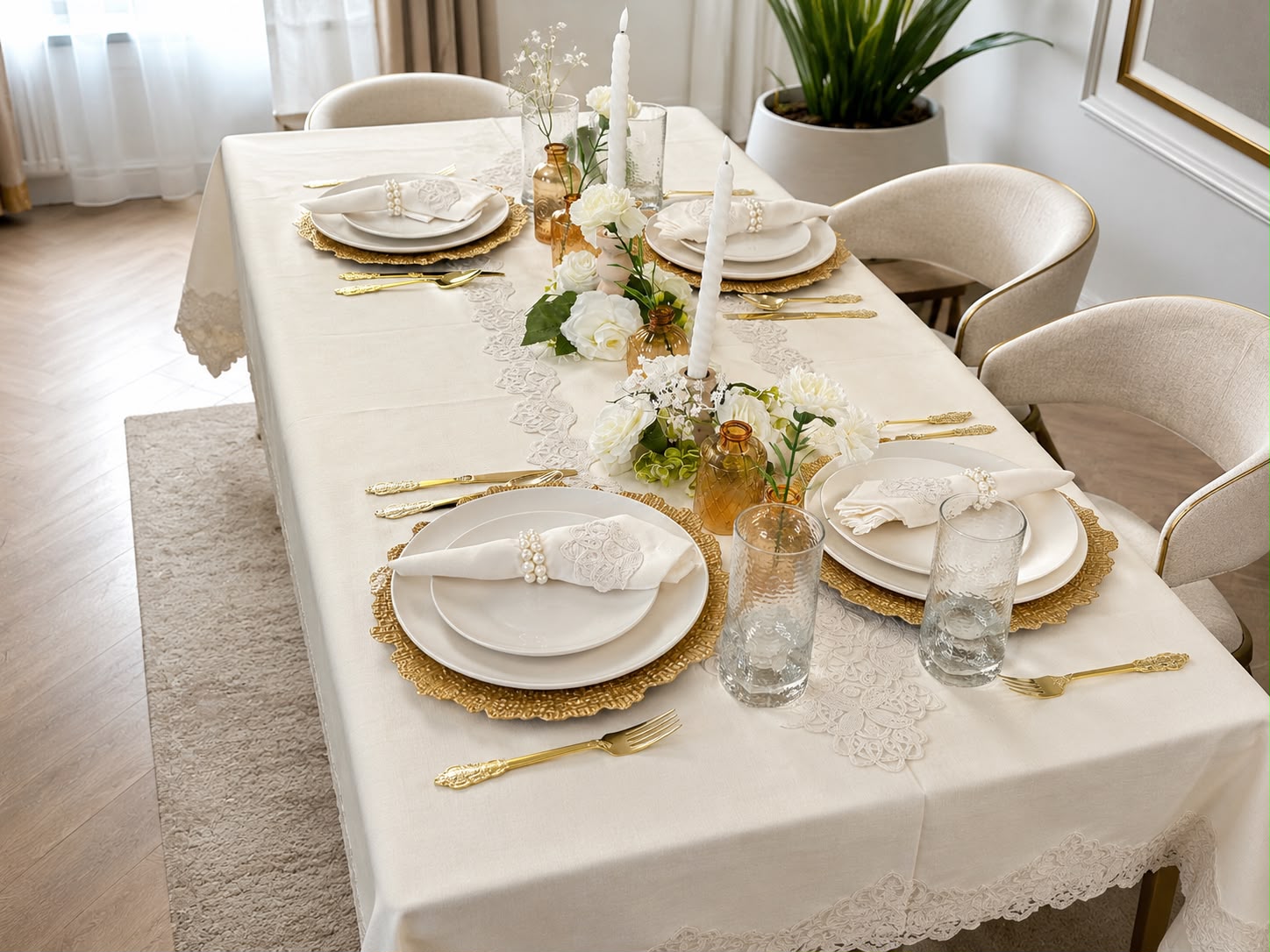 Empire Lumina 26-piece off-white 100% Turkish linen dining table set featuring an embroidered tablecloth, matching table runner, 12 embroidered napkins with 12 pearl napkin rings, elegant white dinnerware, and gold flatware.