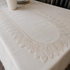 Close-up of the Empire Lumina off-white 100% Turkish linen table runner with intricate embroidered lace, showcasing premium craftsmanship and elegant design.