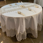 Empire Lumina luxury round tablecloth set with gold lace embroidery, matching table runner and napkins.