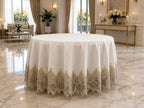 Luxury Turkish linen round tablecloth by Empire Lumina with elegant gold lace embroidery and full-length drape.
