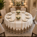 Luxury Turkish linen round tablecloth set with elegant gold lace embroidery, matching table runner, napkins and napkin rings by Empire Lumina.